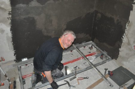 Martin fitting the base for the shower tray